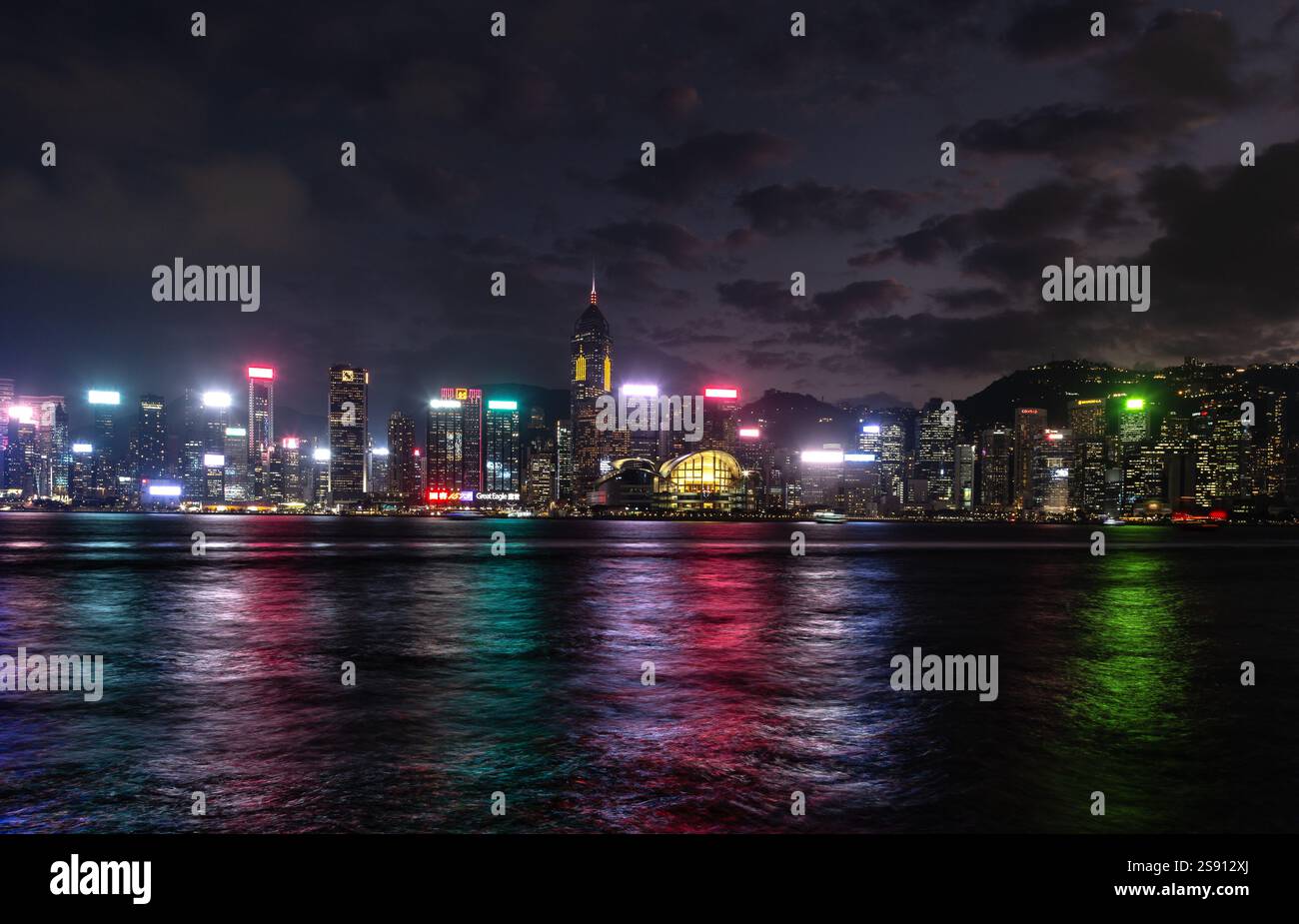 Hong Kong skyline at night viewed from Victoria Harbour Stock Photo - Alamy