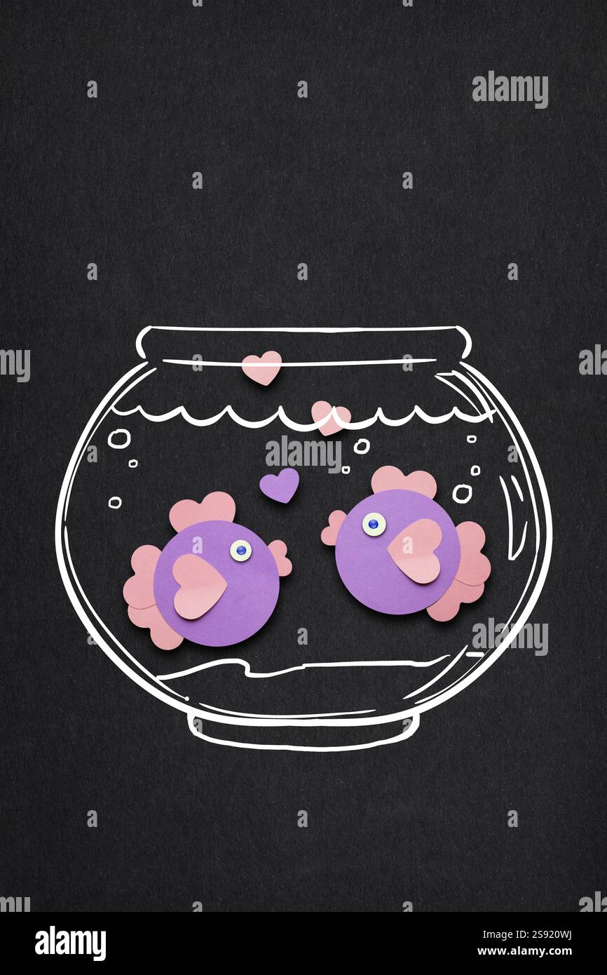 Creative valentines concept photo of paper fish with hearts on black ...