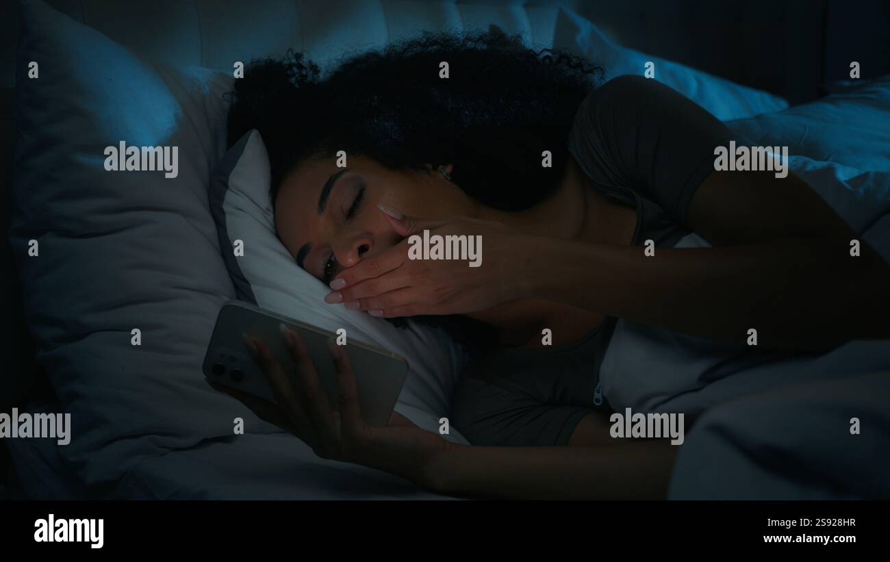 Photo inspiration: African American Girl Blogger Lying In Bed Addicted Mobile Phone Photo Inspiration