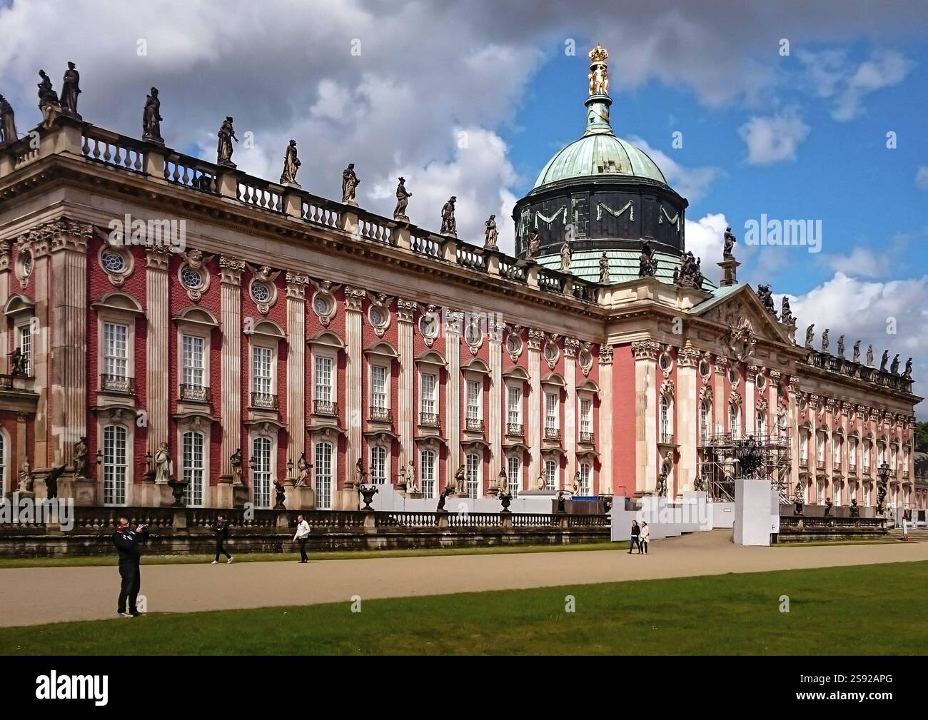 Baroque palace with a copper dome and red facades, surrounded by ...