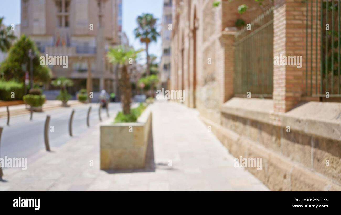 Blurred street view with defocused buildings and a man walking in the ...