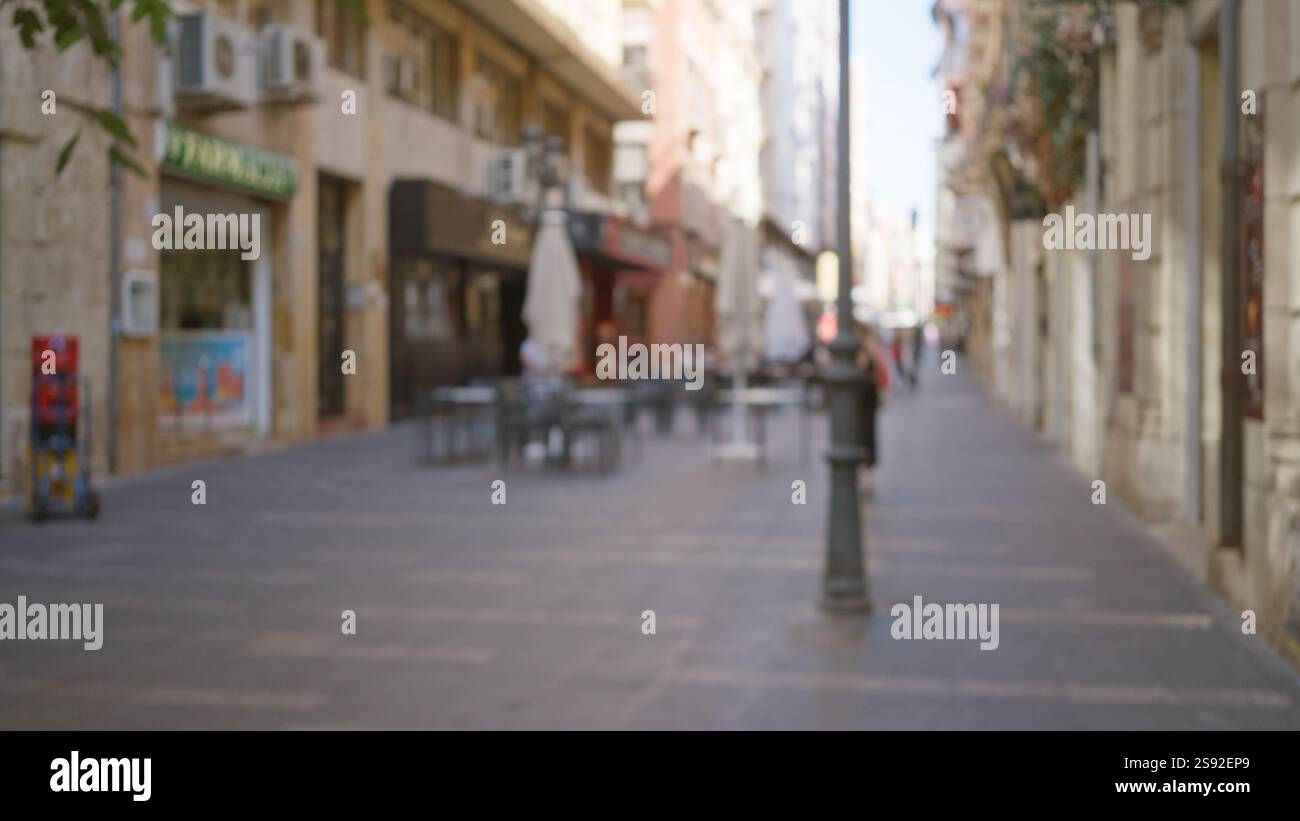 Blurry outdoor street with defocused pedestrians and bokeh-effect ...