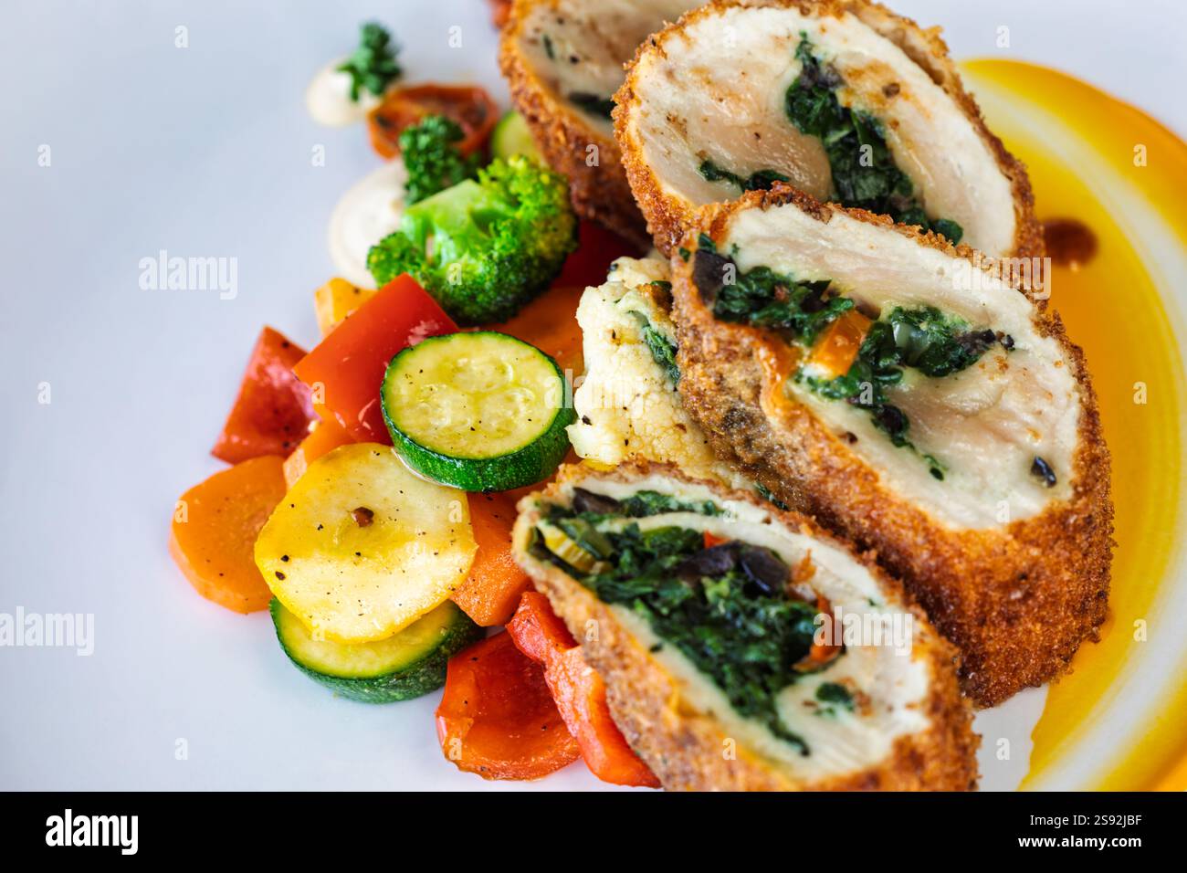 chicken roulade classic with vegetables carrots, potatoes, broccoli ...