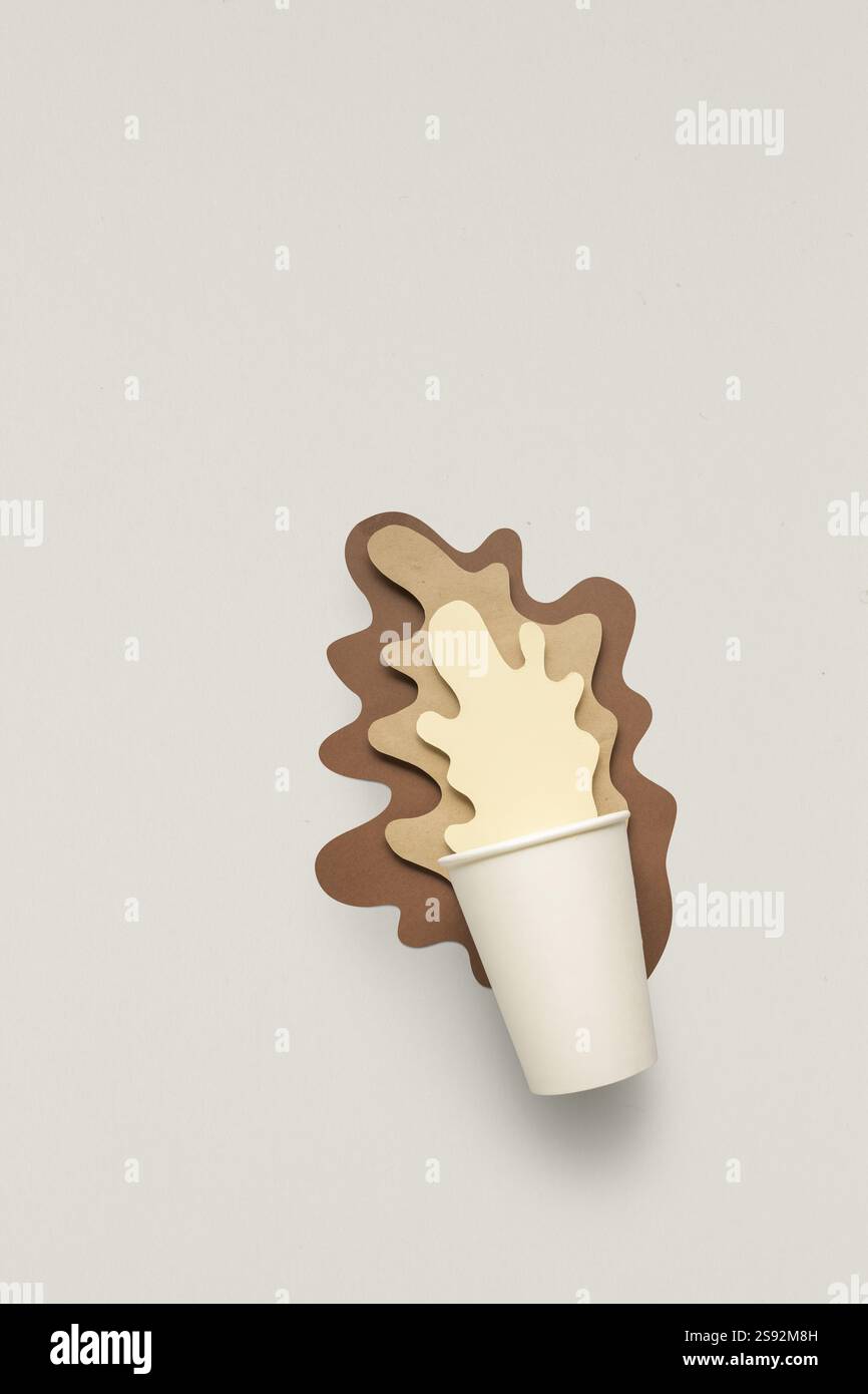 Paper Splashed Coffee Creative concept photo of takeaway cup with splashing paper coffee on ...