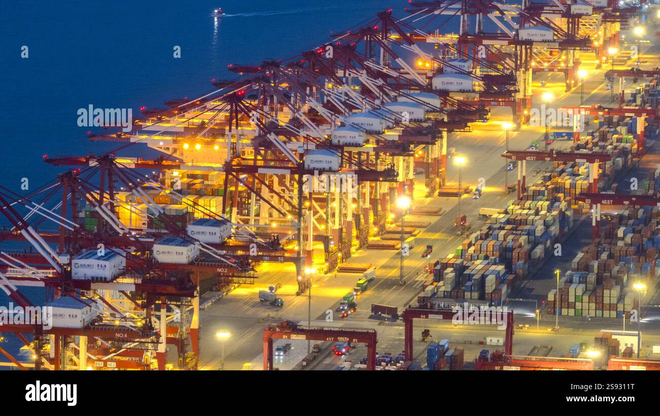 QINGDAO, CHINA - JANUARY 24, 2025 - Container ships dock at the berth ...