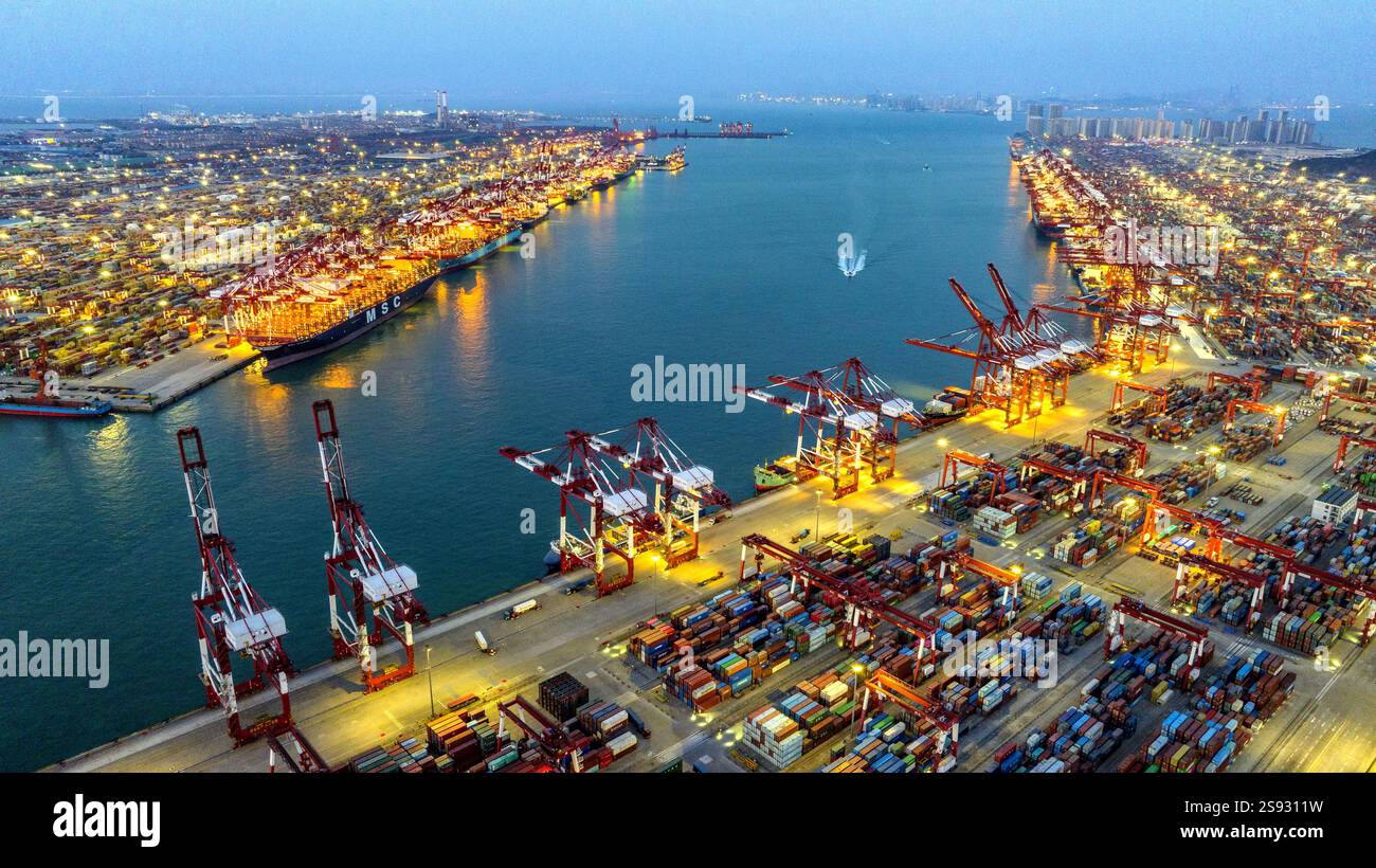 QINGDAO, CHINA - JANUARY 24, 2025 - Container ships dock at the berth ...