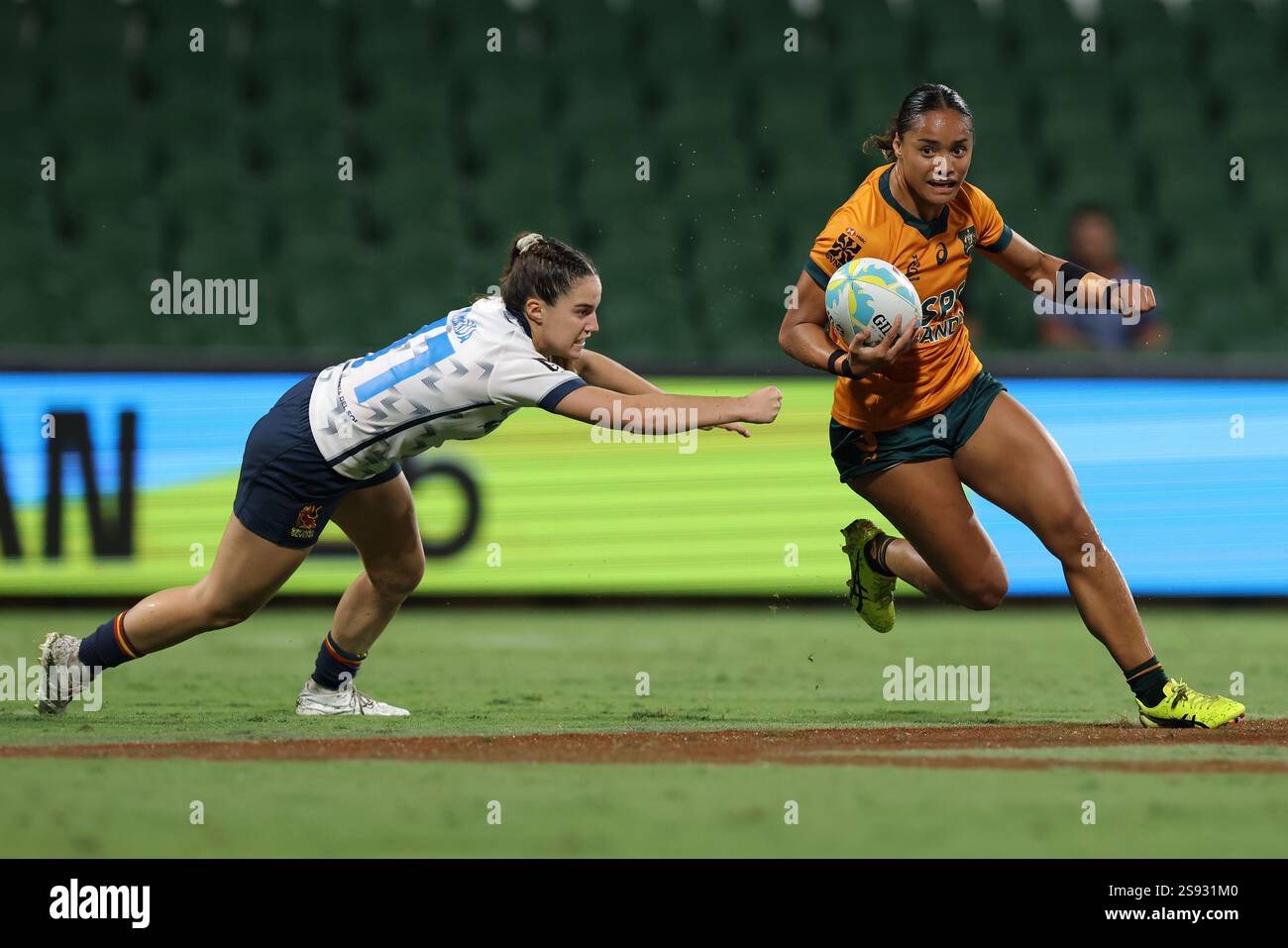 Faith Family Rugby Faith Nathan of Australia runs the ball against Spain during the Rugby ...