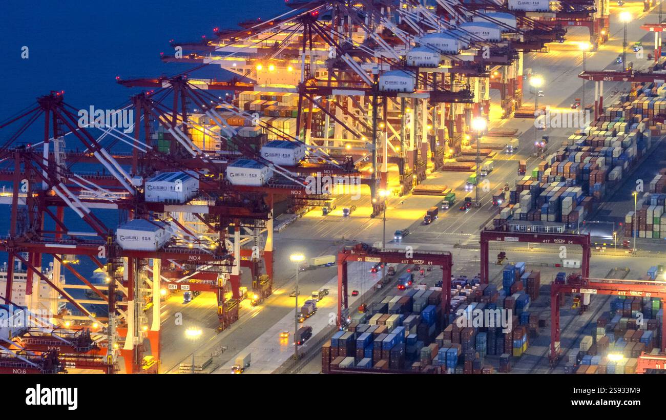 QINGDAO, CHINA - JANUARY 24, 2025 - Container ships dock at the berth ...