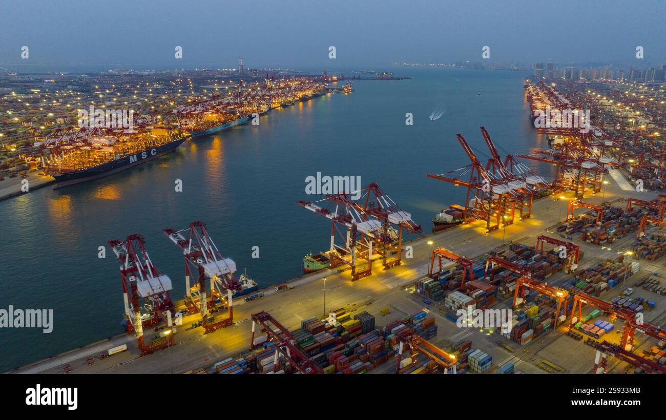 QINGDAO, CHINA - JANUARY 24, 2025 - Container ships dock at the berth ...