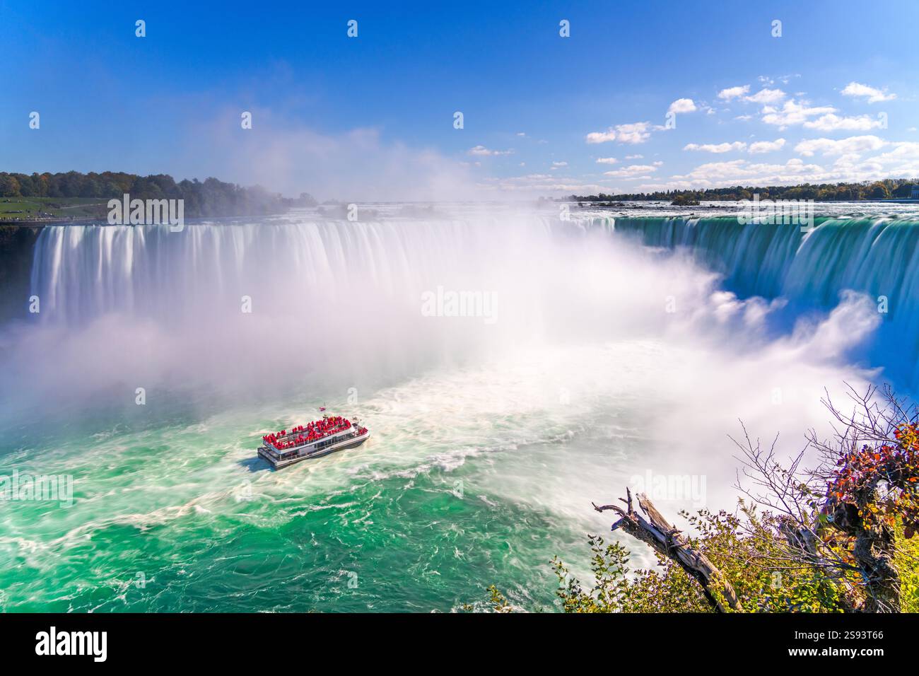 Niagara Falls between New York and Ontario with a tour boat Stock Photo ...