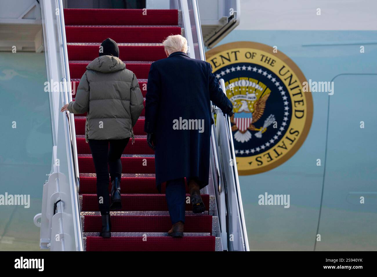 President Donald Trump and first lady Melania Trump board Air Force One