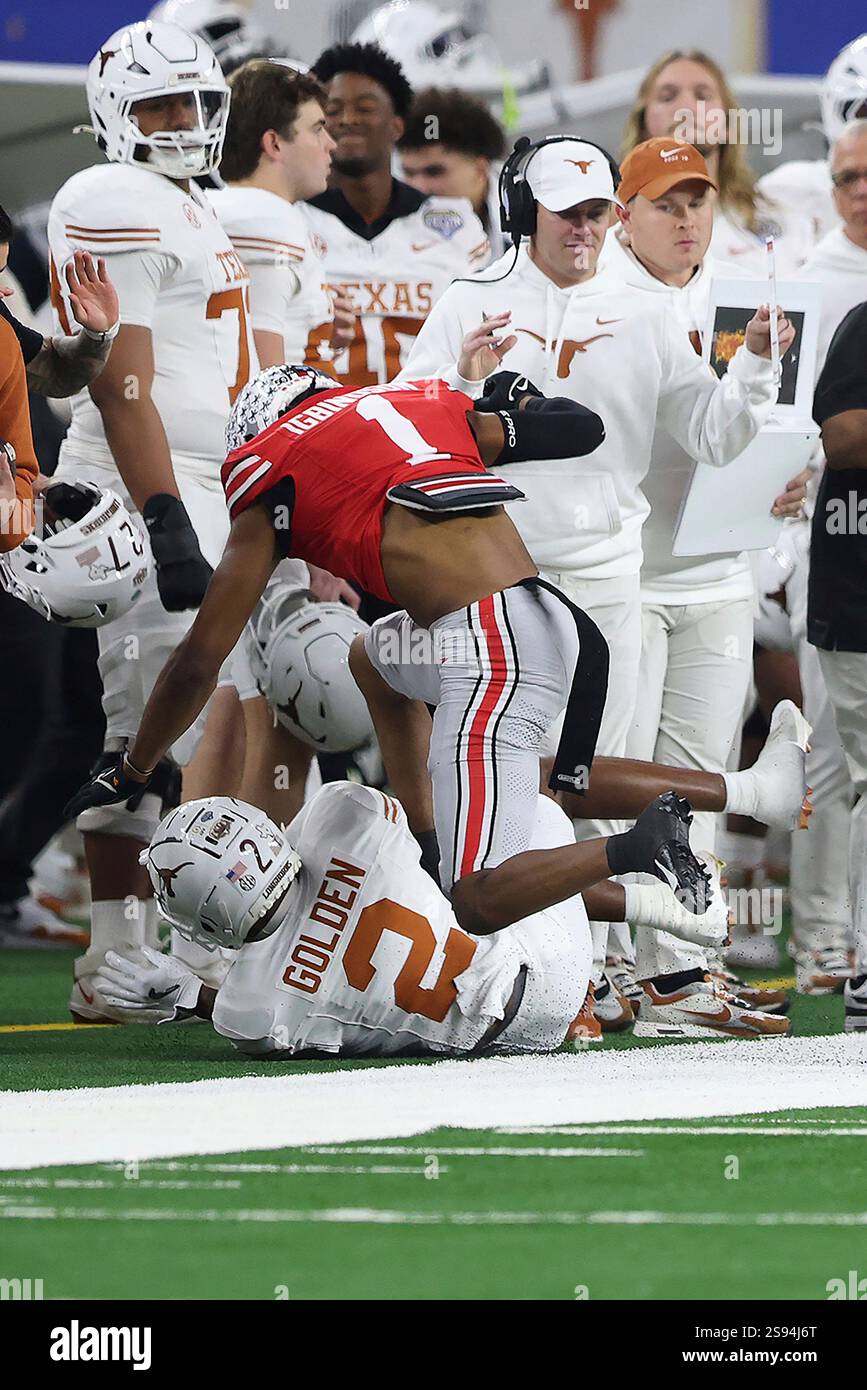 Ohio State cornerback Davison Igbinosun (1) tackles Texas receiver