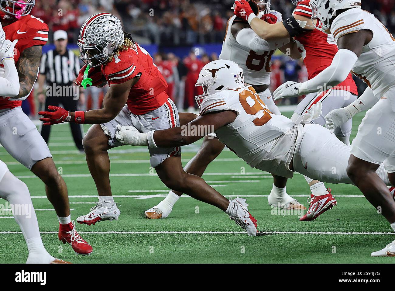 Ohio State running back Quinshon Judkins (1) runs nine yards for a