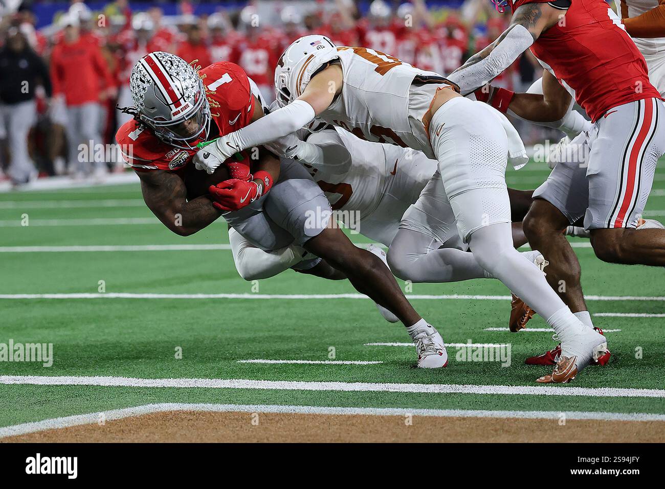 Ohio State running back Quinshon Judkins (1) runs nine yards for a