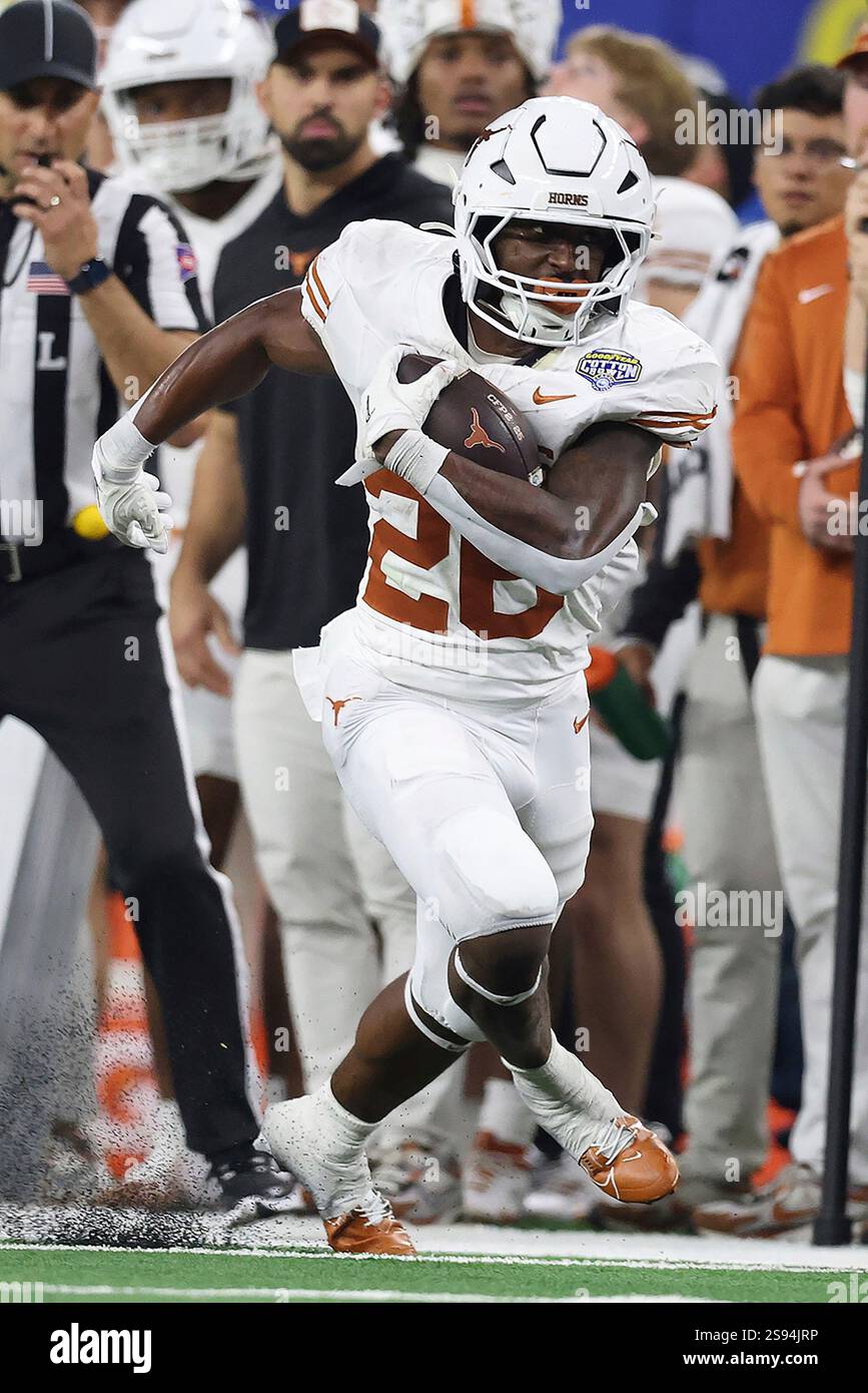 Texas running back Quintrevion Wisner (26) runs during the Cotton Bowl