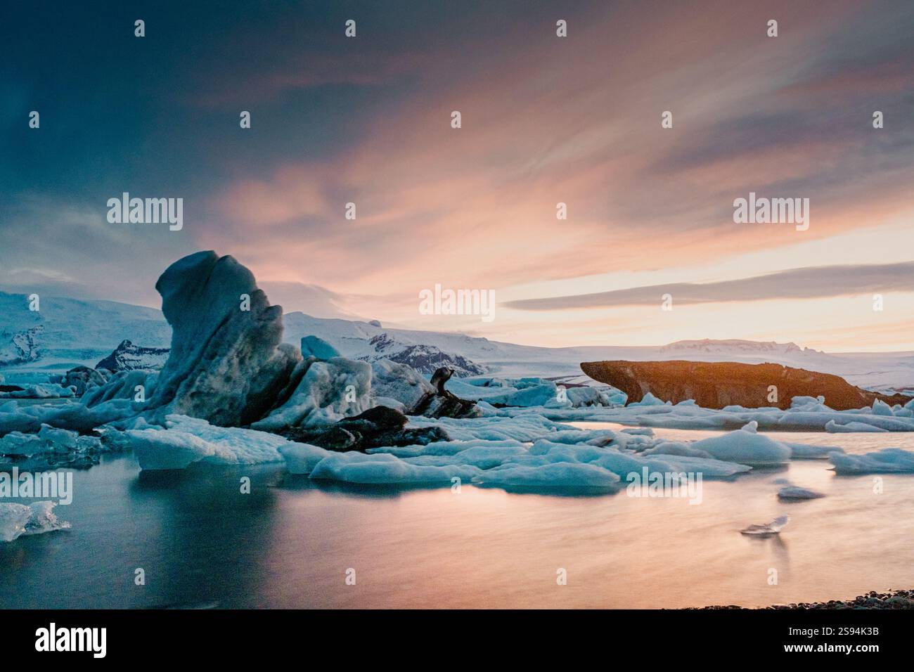 Breathtaking sunset over Jokulsarlon glacier lagoon with floating ...