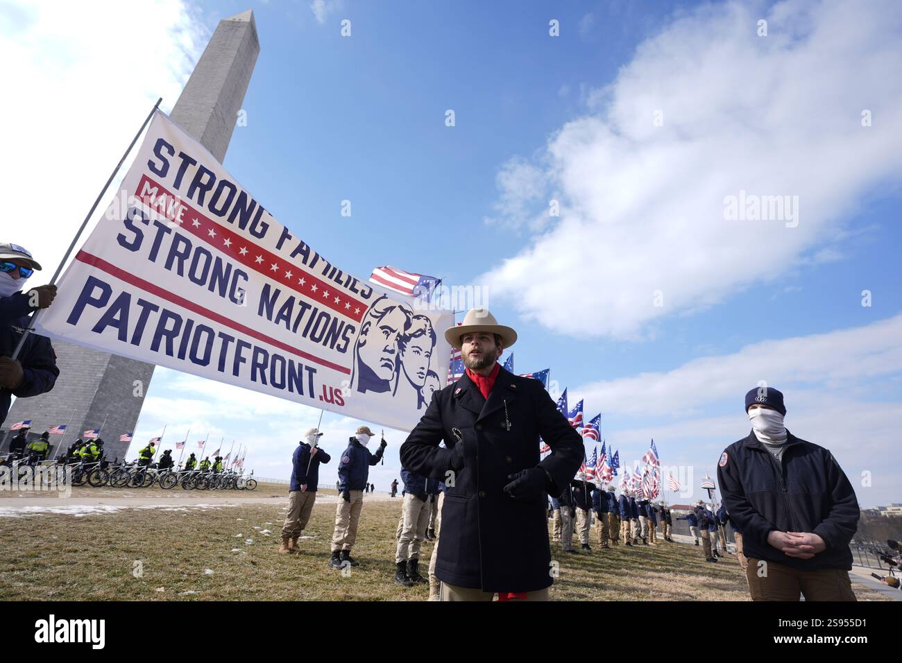 Thomas Ryan Rousseau, center, and members of a group calling themselves ...