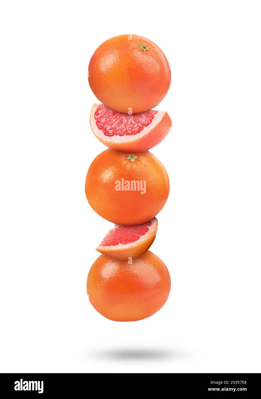 Fresh grapefruits in air on white background Stock Photo