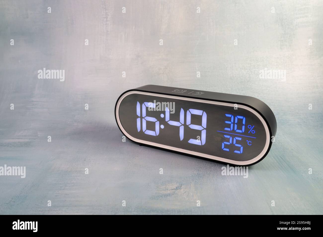 Black Electronic Desk Clock Displaying Time, Temperature, and Humidity ...