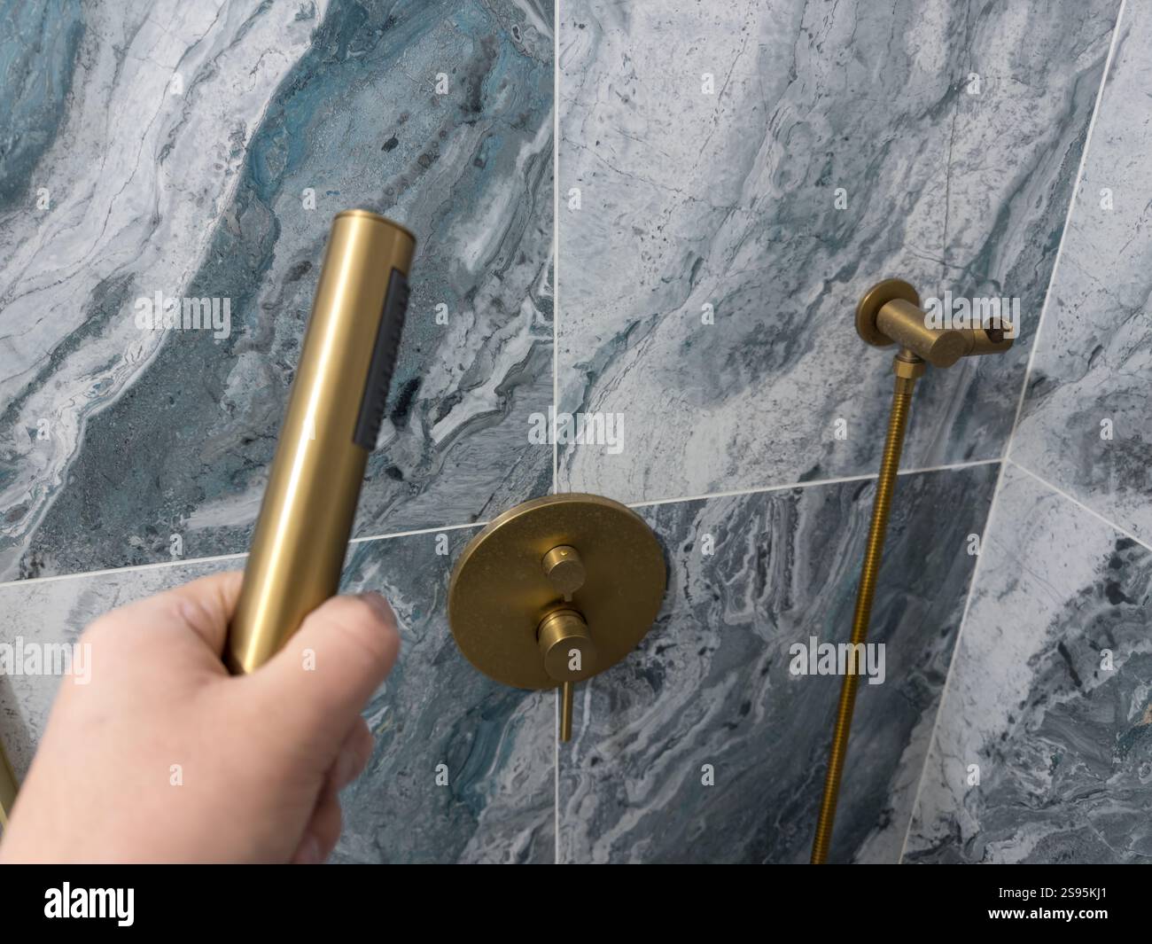 Elegant bathroom setup with gold fixtures and modern design elements Stock Photo