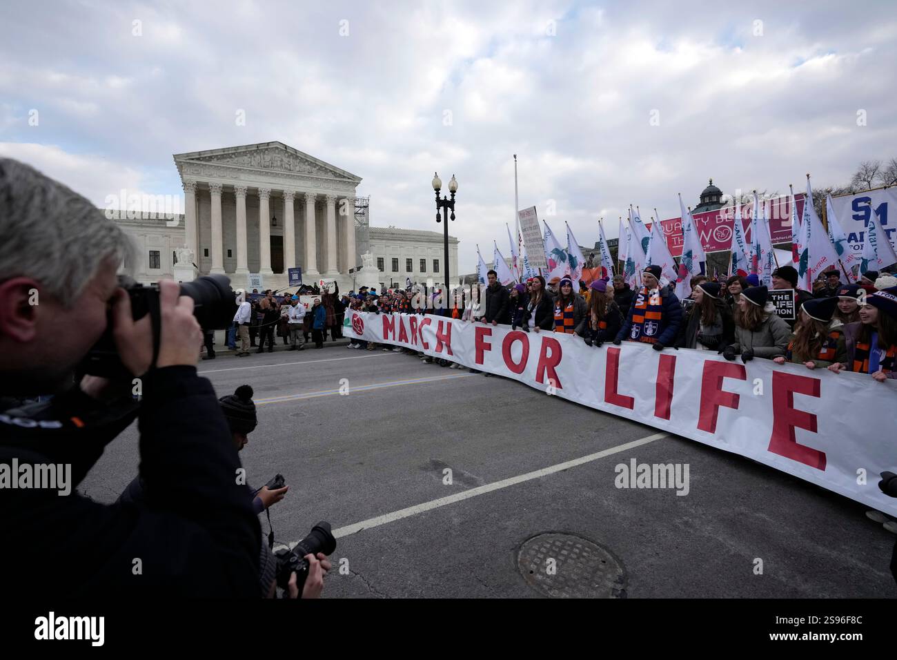 People participating in the annual March for Life, walk past the