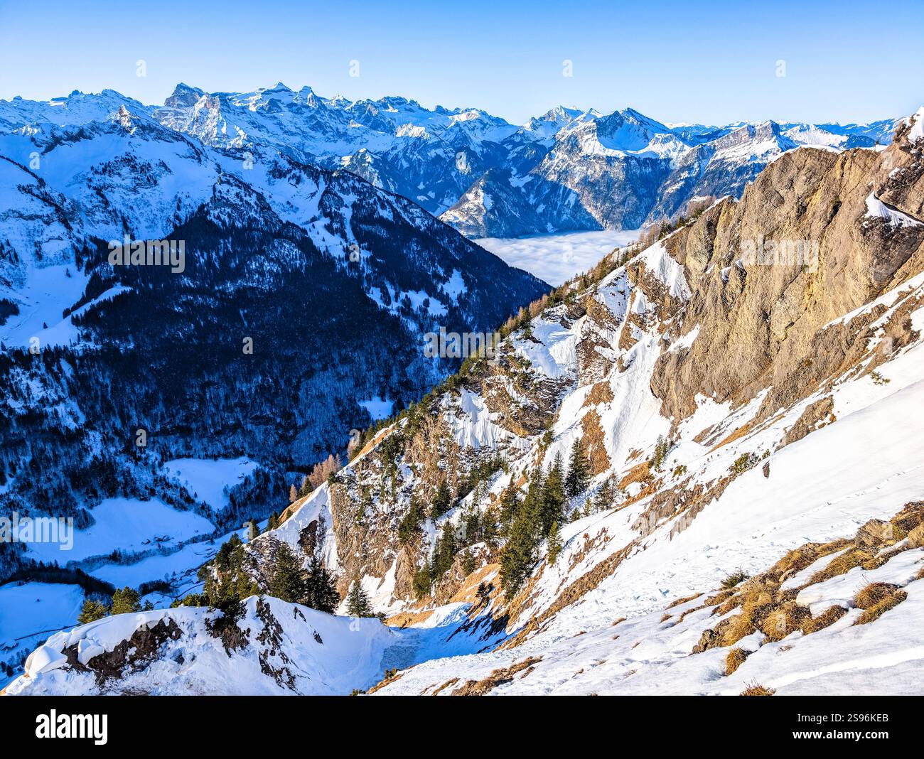 Stoos View Aerial drone view of snow covered mountains and ski slopes, ski area ...