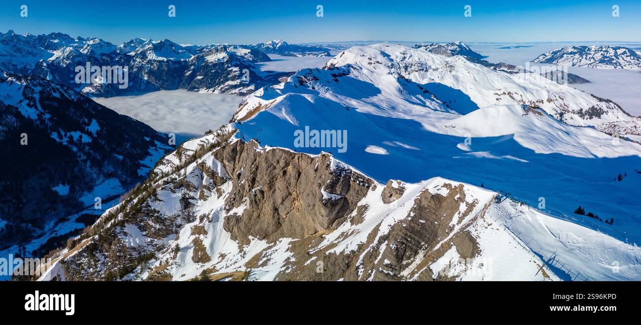 Stoos View Aerial drone view of snow covered mountains and ski slopes, ski area ...