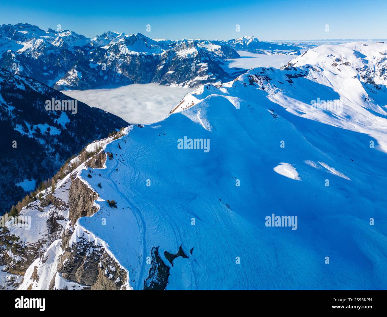 Stoos View Aerial drone view of snow covered mountains and ski slopes, ski area ...