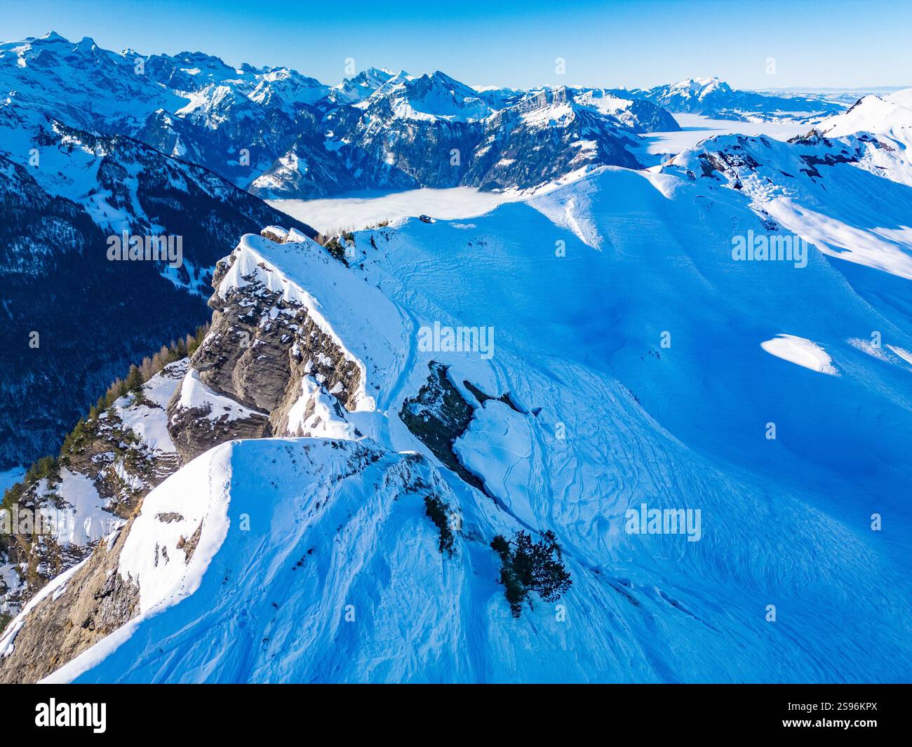 Stoos View Aerial drone view of snow covered mountains and ski slopes, ski area ...