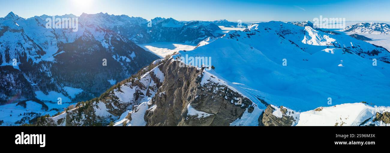 Stoos View Aerial drone view of snow covered mountains and ski slopes, ski area ...