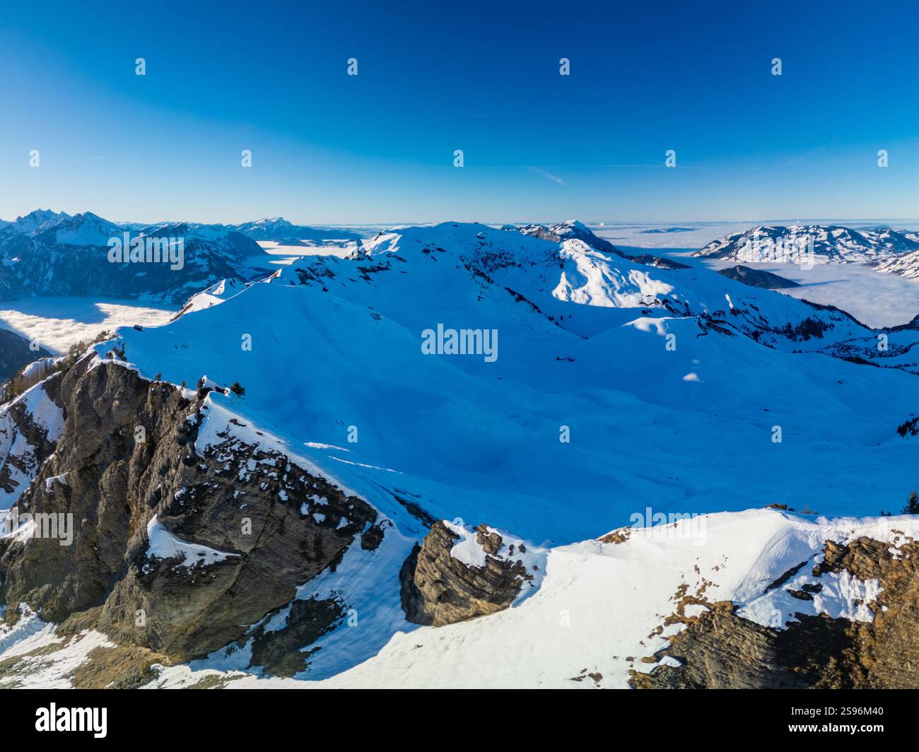 Stoos View Aerial drone view of snow covered mountains and ski slopes, ski area ...