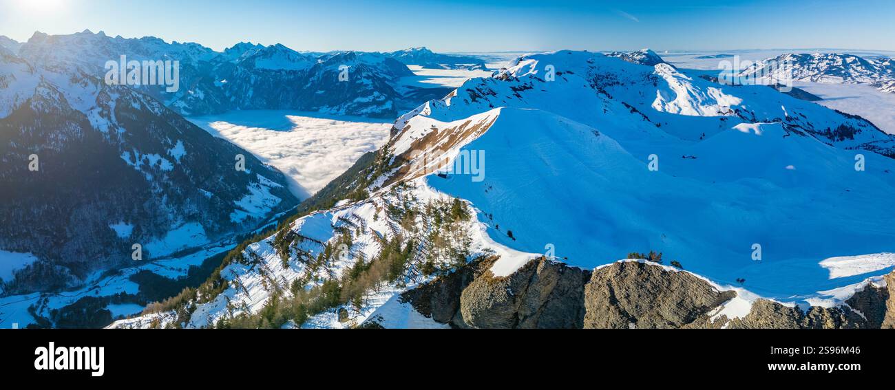 Stoos View Aerial drone view of snow covered mountains and ski slopes, ski area ...