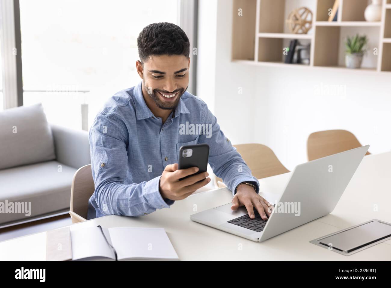 Man Using Tech Man engaging in workflow using modern wireless tech Stock Photo - Alamy