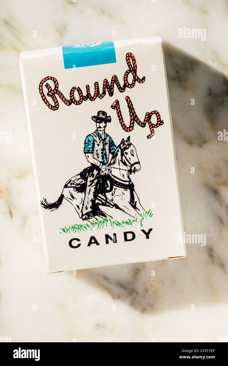 pack of Round Up Candy Cigarettes with classic cowboy illustration on box  Stock Photo