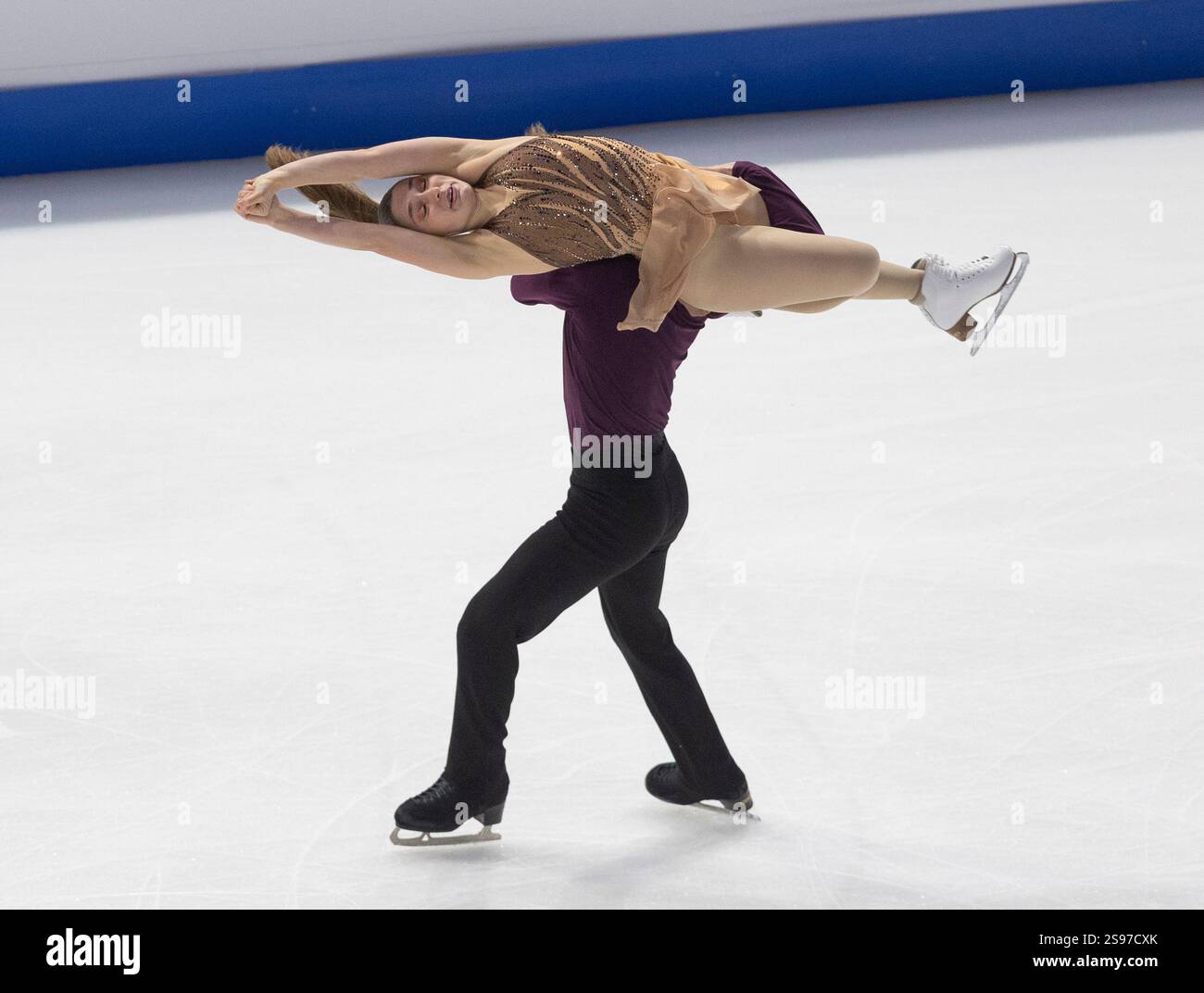 Oona Brown, top, and Gage Brown, bottom, perform during the ice dance