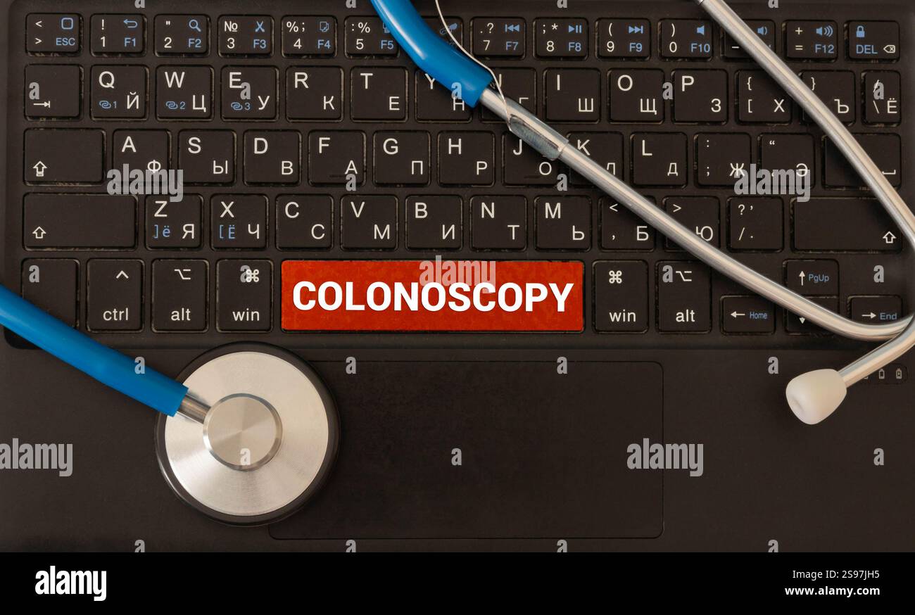 Tablet with the text Colonoscopy on the display. Stock Photo