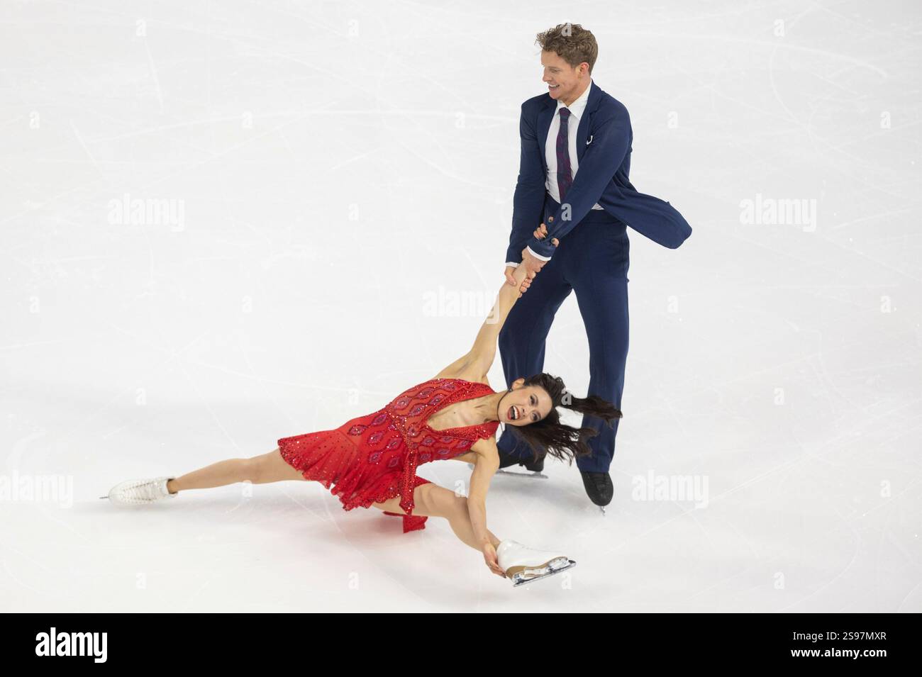 Madison Chock, bottom, and Evan Bates, top, perform during the ice dance rhythm dance