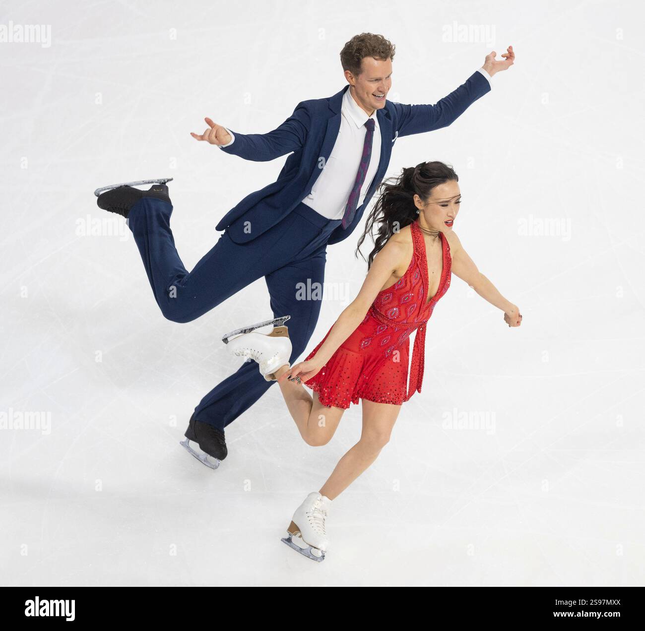 Madison Chock, right, and Evan Bates, left, perform during the ice dance rhythm dance
