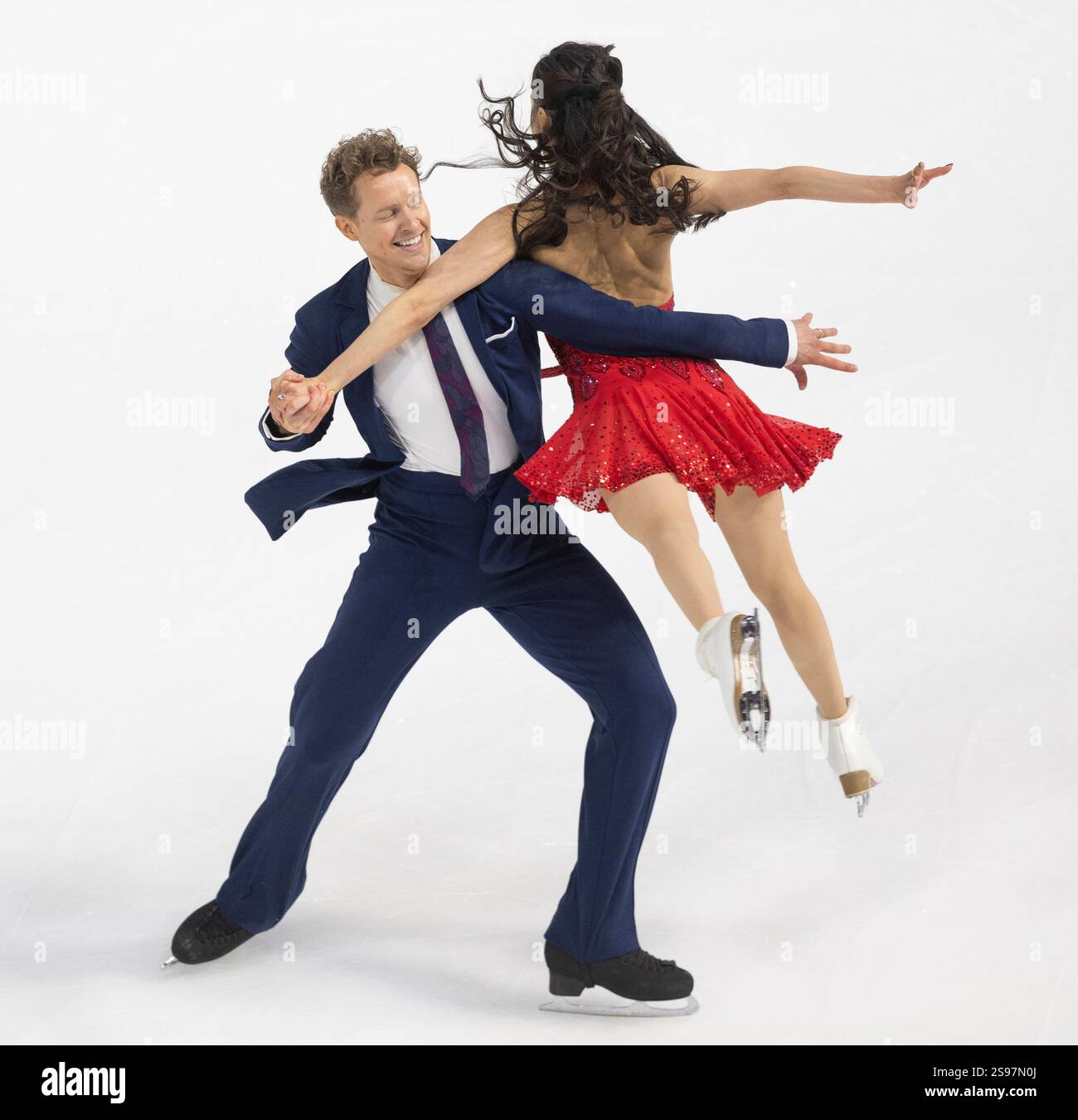 Madison Chock, right, and Evan Bates, left, perform during the ice dance rhythm dance