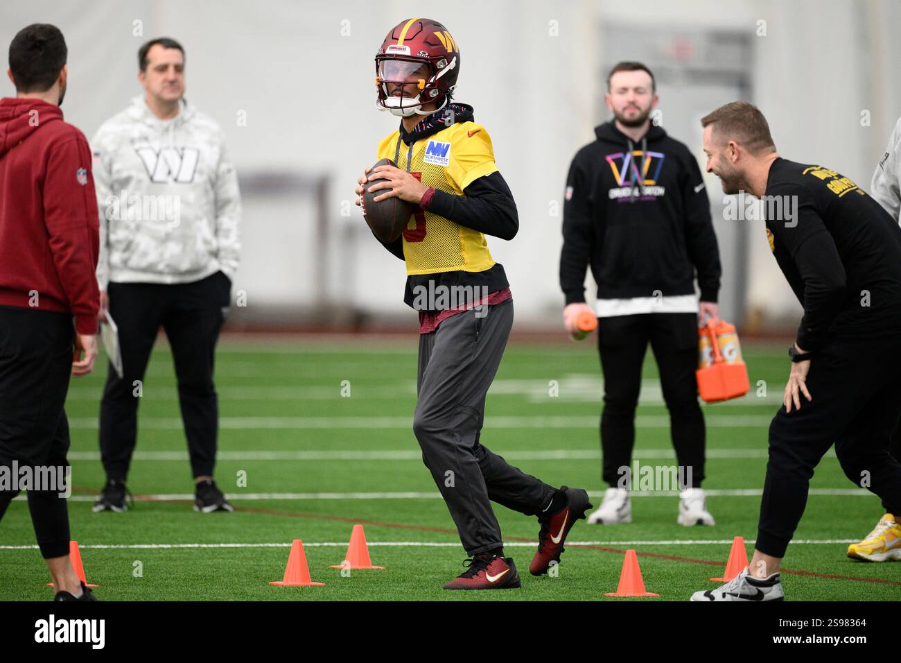 Washington Commanders quarterback Jayden Daniels (5) works out during