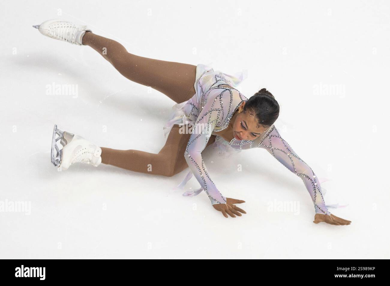 Starr Andrews falls during her performance during the women's free