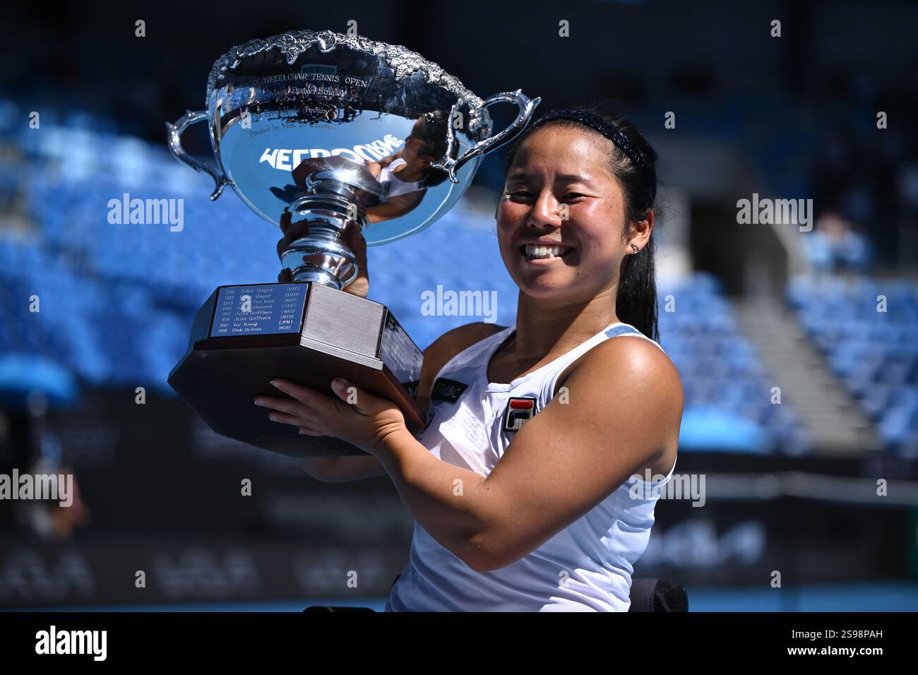 Yui Kamiji of Japan with the winners trophy following her Women’s ...