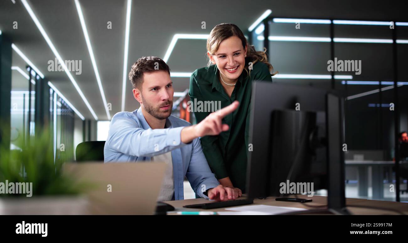 Business Data Analysts Man And Woman Using Computer Stock Photo