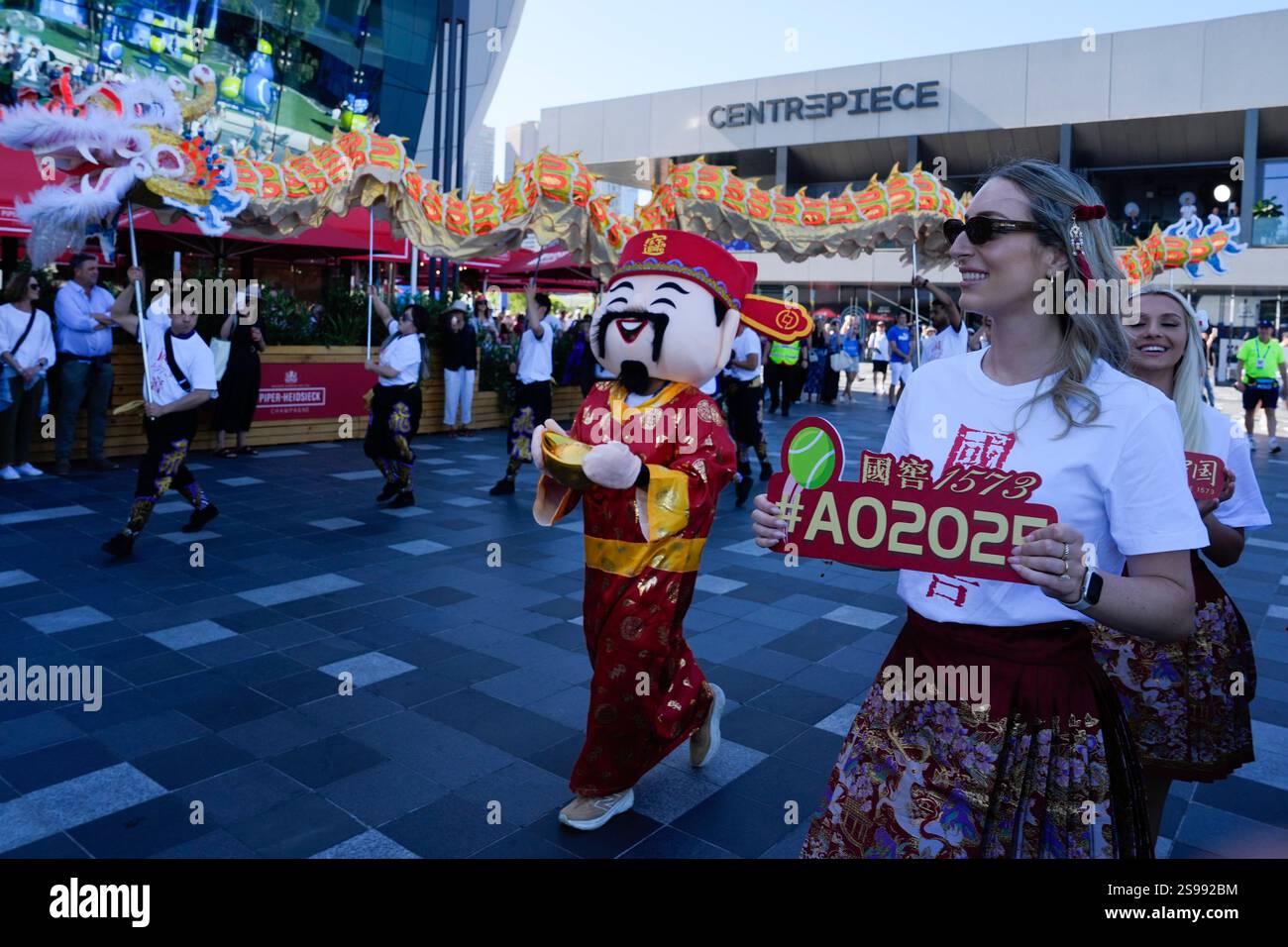 Lion and dragon dancers perform outside Rod Laver Arena to celebrate