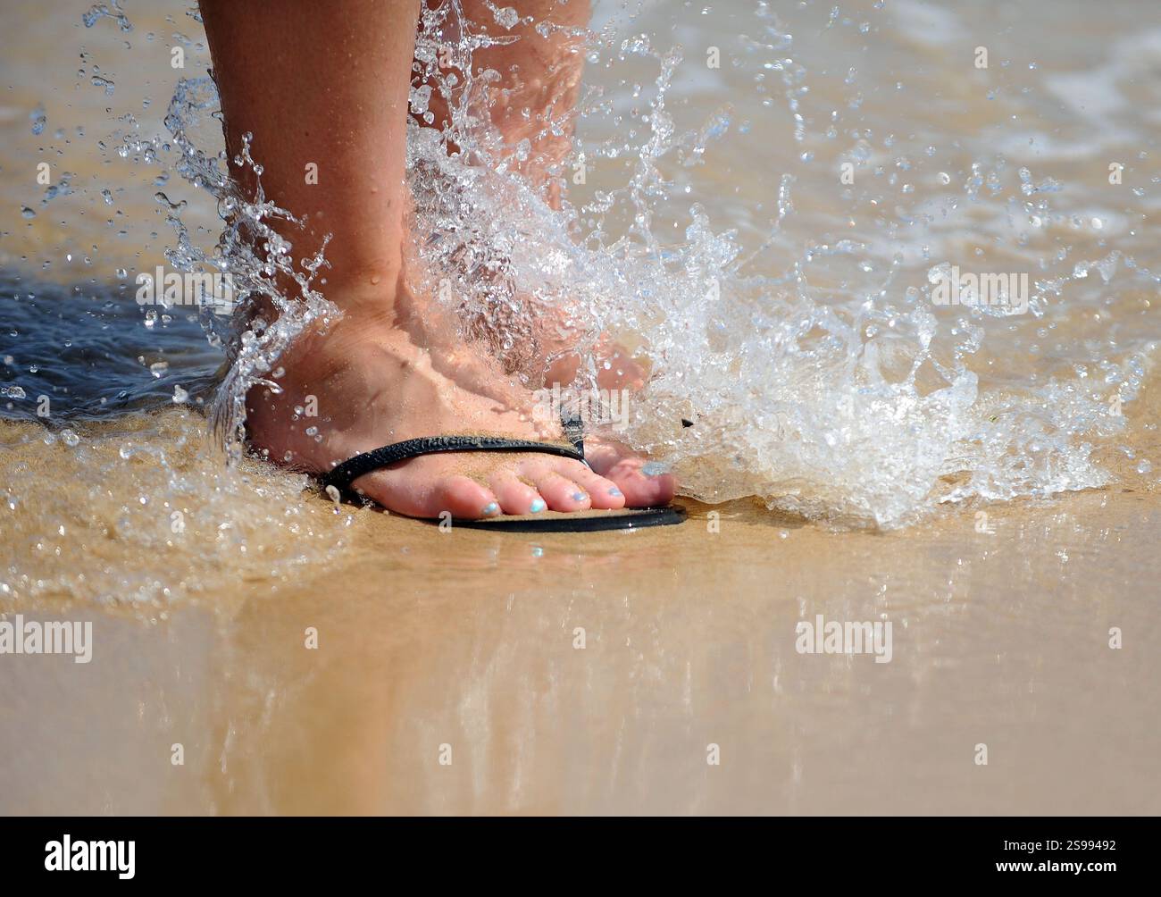 file-photo-dated-12-06-14-of-feet-in-flip-flops-on-the-beach-at-praia