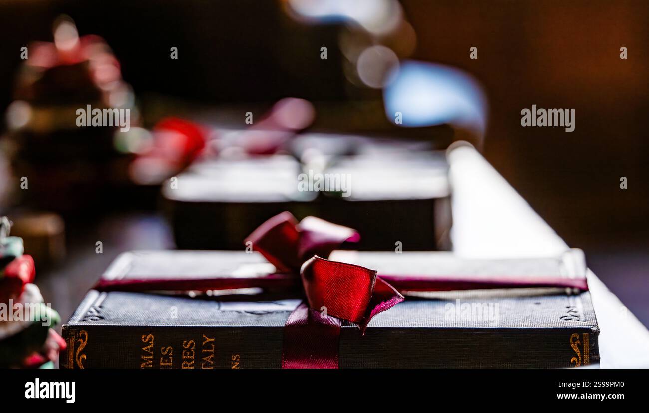 Book wrapped in ribbon hi-res stock photography and images - Alamy