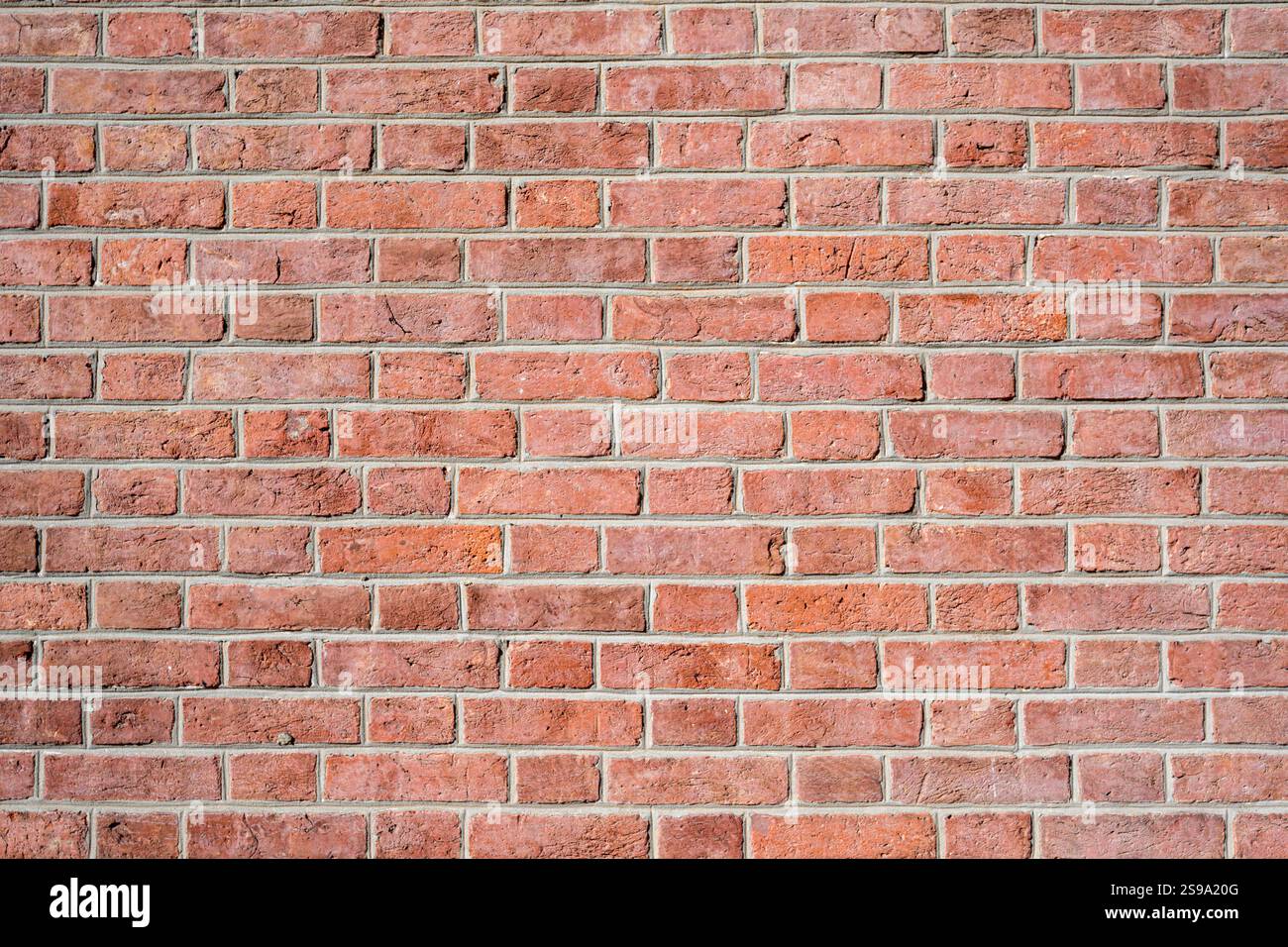Background from a wall made of clean red bricks Stock Photo