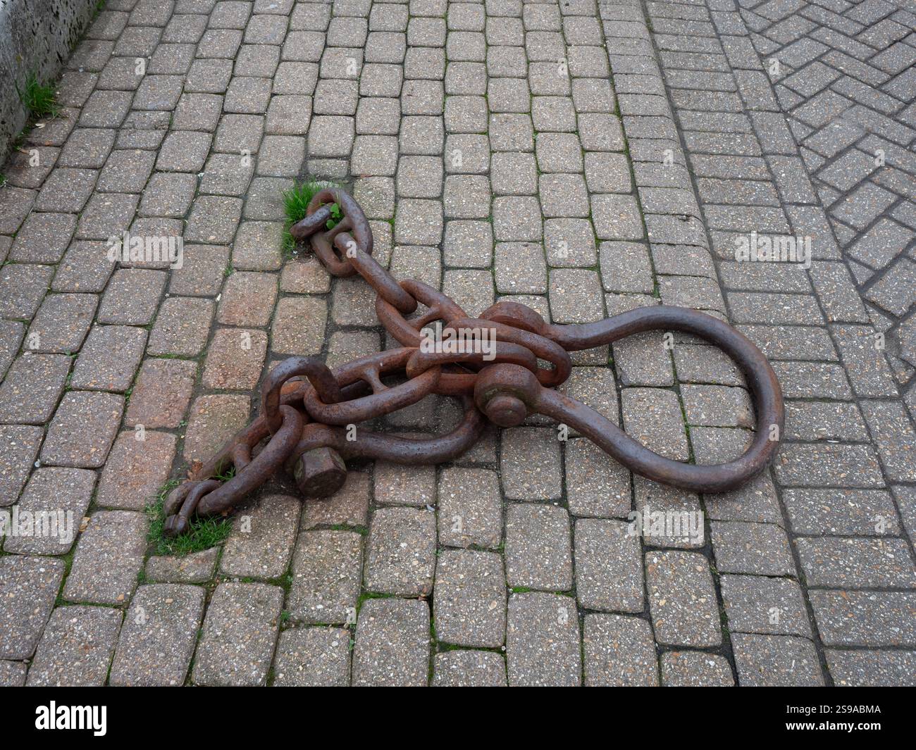 rusty chain on the quayside Stock Photo
