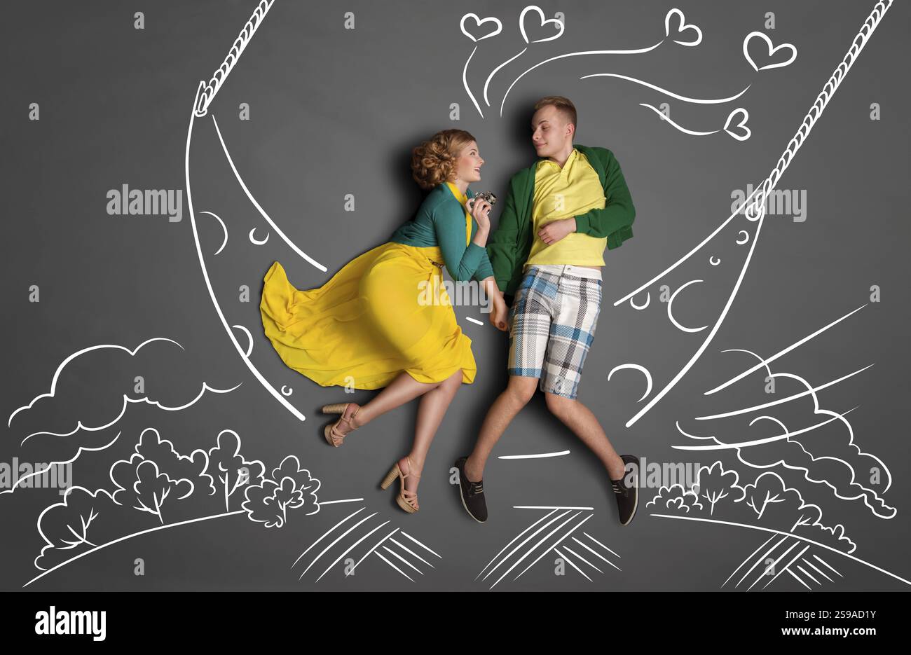 Happy valentines love story concept of a romantic couple rocking on the ...