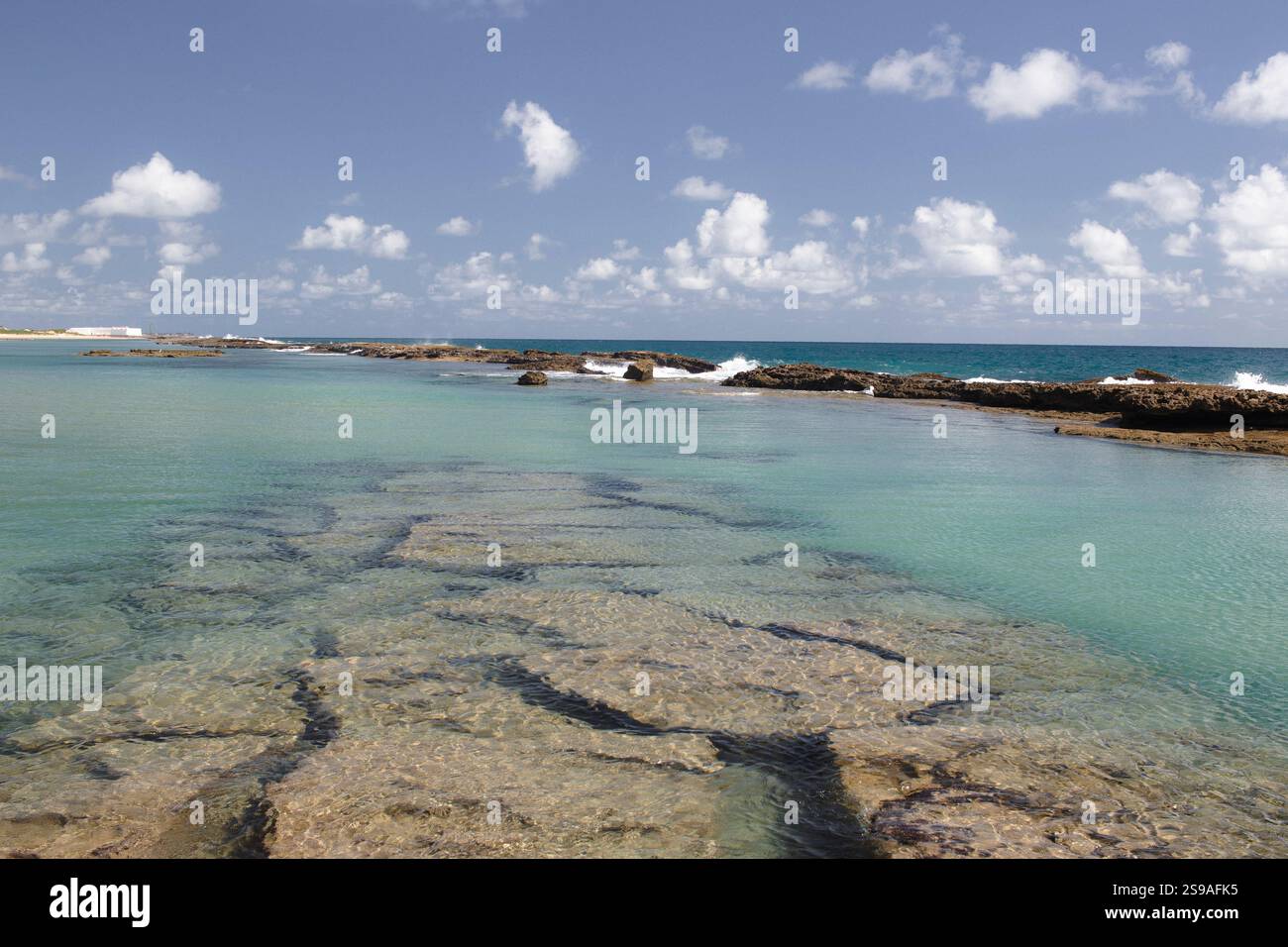 Serene Coastal Landscape with Clear Waters and Rocky Shoreline Stock ...